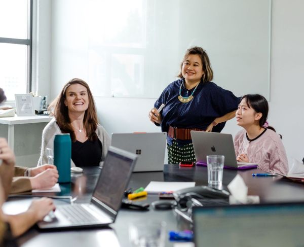 Senior Accounting Lead, Fernanda Marx; Co-CEO, Tania Lo; and Digital Support Specialist, Wendy Tan Discussing Business Process Improvement Tactics in Vancouver, BC.